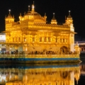 Golden Temple, a radiant and serene religious shrine reflecting in a tranquil pool of water.