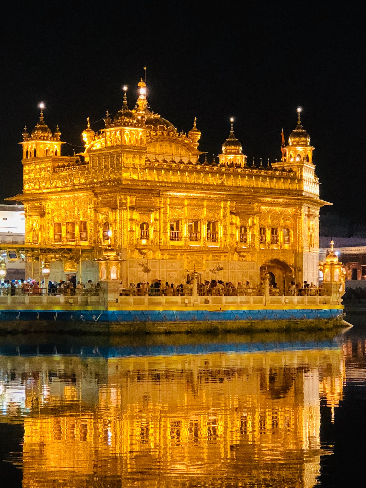 Golden Temple, a radiant and serene religious shrine reflecting in a tranquil pool of water.