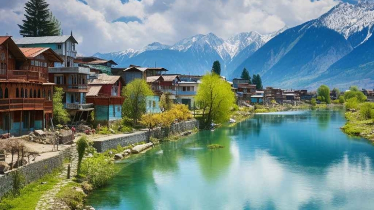 The serene village of Kashmir, nestled amidst the breathtaking mountain range, offers a mesmerizing sight.