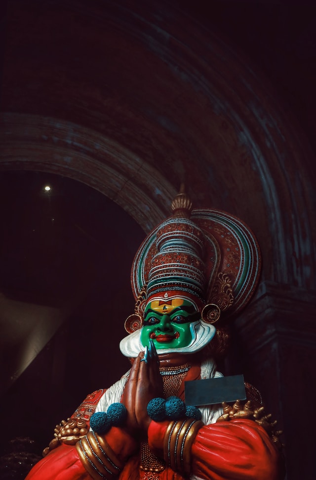 Vibrant Kerala tradition: Traditional attire, Kathakali dance, lush greenery.