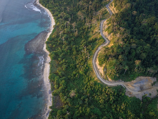 Panoramic view of the pristine beaches and lush greenery of the Andaman and Nicobar Islands, showcasing the natural beauty and serene landscapes of this tropical paradise.