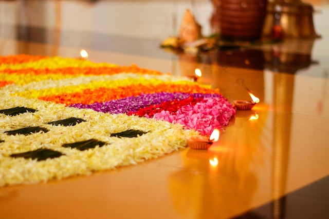 An enchanting Onam image showcasing the traditional flower carpet (pookalam) and a grand feast on banana leaves, symbolizing the festival's cultural richness.