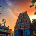 Image of Kapaleeshwar Temple in Chennai, a vibrant and ornate South Indian temple with colorful Dravidian architecture, intricate sculptures, and a towering gopuram.