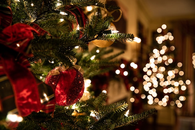 A heartwarming Christmas scene with a decorated tree, presents, and a cozy fireplace, evoking the holiday spirit.