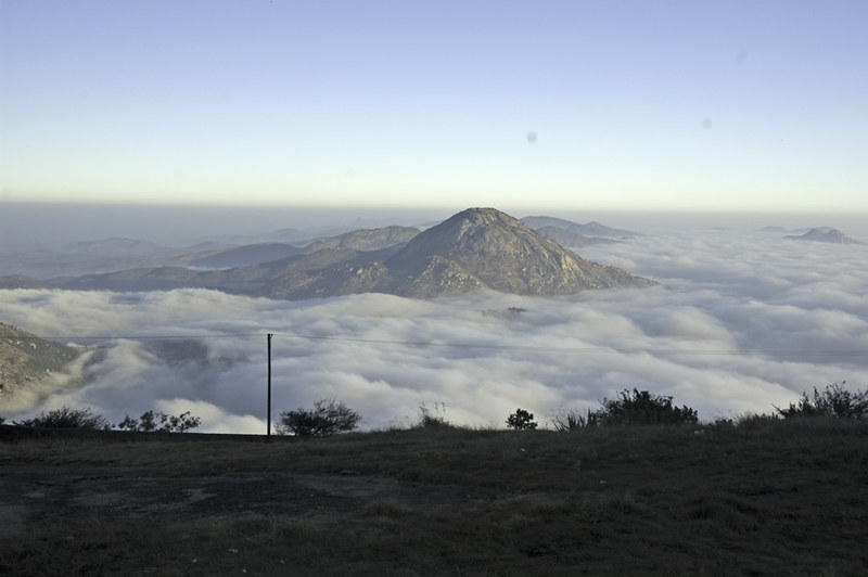 A captivating view of Nandi Hills in Karnataka, showcasing its serene beauty and lush landscapes, making it a tranquil gem for tourists to explore.