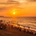 Sunset over the serene waters of Pondicherry, showcasing tranquility and diversity.