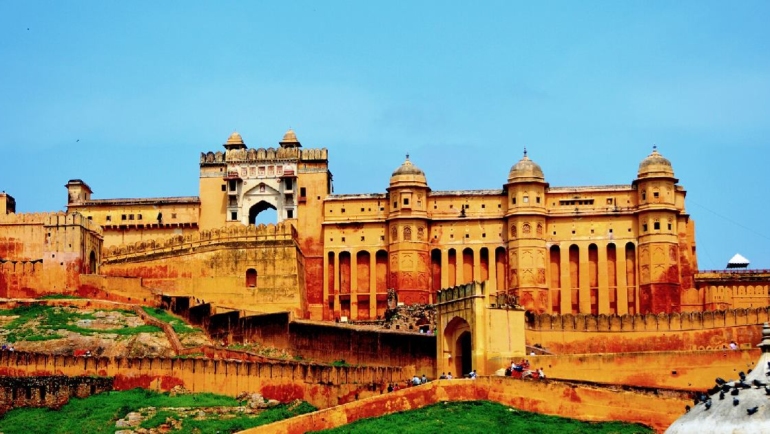 A panoramic view of Amber Palace, showcasing its regal architecture, intricate designs, and the surrounding hills, encapsulating the royal splendor of Jaipur's historic gem.