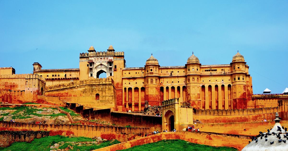 A panoramic view of Amber Palace, showcasing its regal architecture, intricate designs, and the surrounding hills, encapsulating the royal splendor of Jaipur's historic gem.