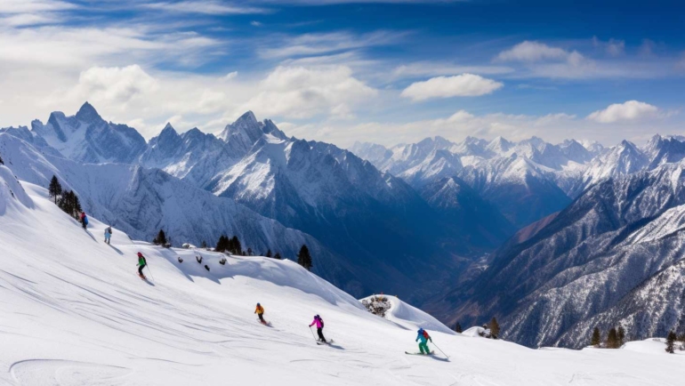 A panoramic view of snow-covered Auli, Uttarakhand, with skiers enjoying the pristine slopes.