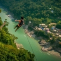 Excited bungee jumper leaping off the platform in Rishikesh.