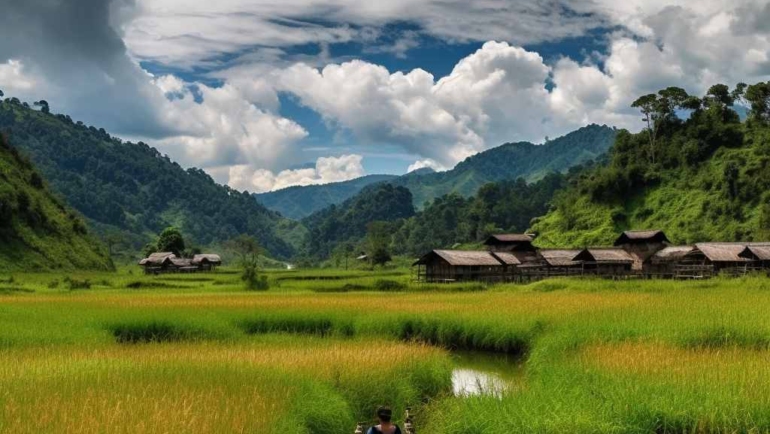 Sunset over Ziro Valley, showcasing lush green landscapes and rolling hills.