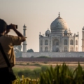 Top Places in India: A vibrant image showcasing the Taj Mahal during sunset, with its ivory-white marble glowing under the warm hues of the evening sky.