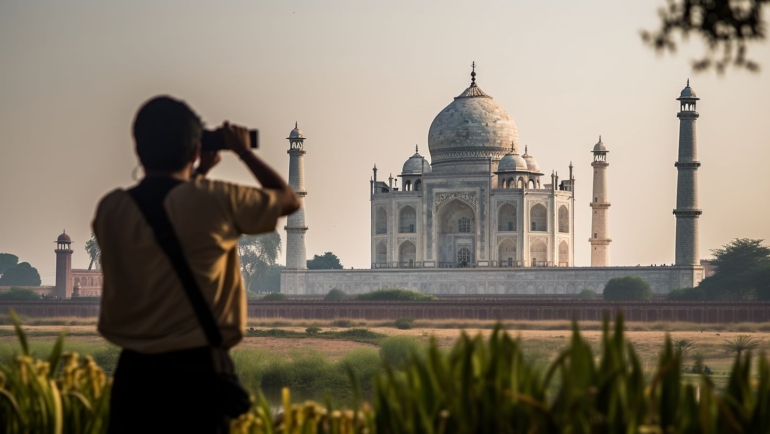 Top Places in India: A vibrant image showcasing the Taj Mahal during sunset, with its ivory-white marble glowing under the warm hues of the evening sky.